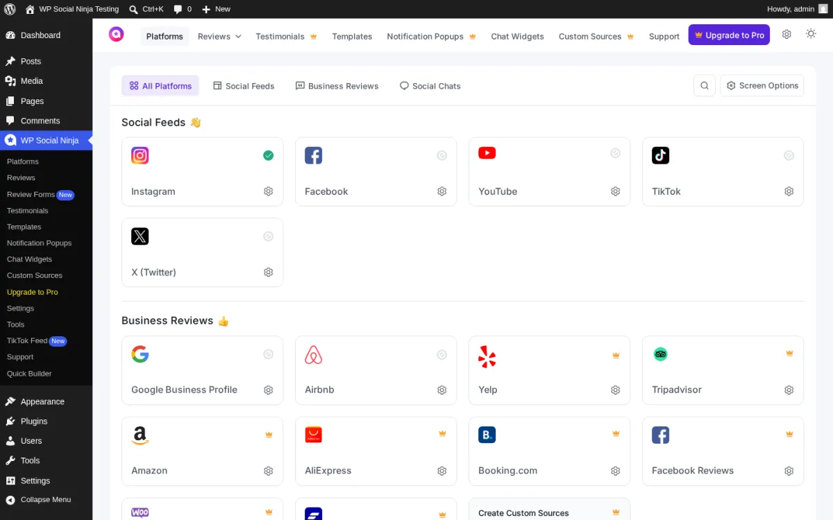 Vista general de plataformas de WP Social Ninja con tres secciones: Social Feeds (Instagram, Facebook, YouTube, TikTok, X), Business Reviews (Google, Airbnb, Yelp, Tripadvisor, Amazon, AliExpress, Booking, Facebook, WooCommerce, FluentCart) y tarjetas de Custom Sources / Chat Widget